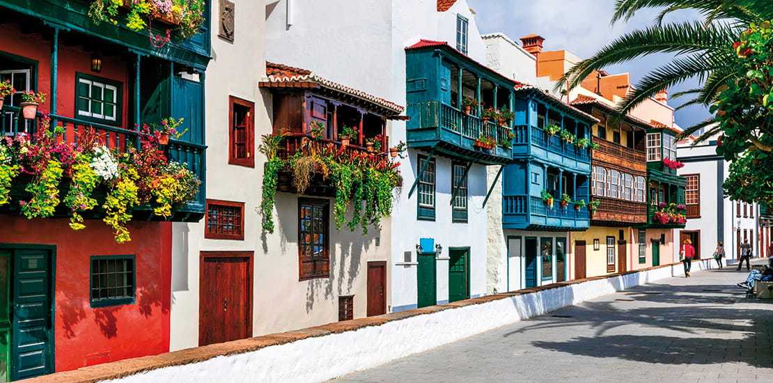 Colourful houses covered in flowers in a street in Santa Cruz, La Palma, Canary Islands